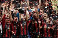 Dec 8, 2018; Atlanta, GA, USA; Atlanta United midfielder Miguel Almiron (10) celebrates with teammates after defeating the Portland Timbers in the 2018 MLS Cup championship game at Mercedes-Benz Stadium. Brett Davis-USA TODAY Sports