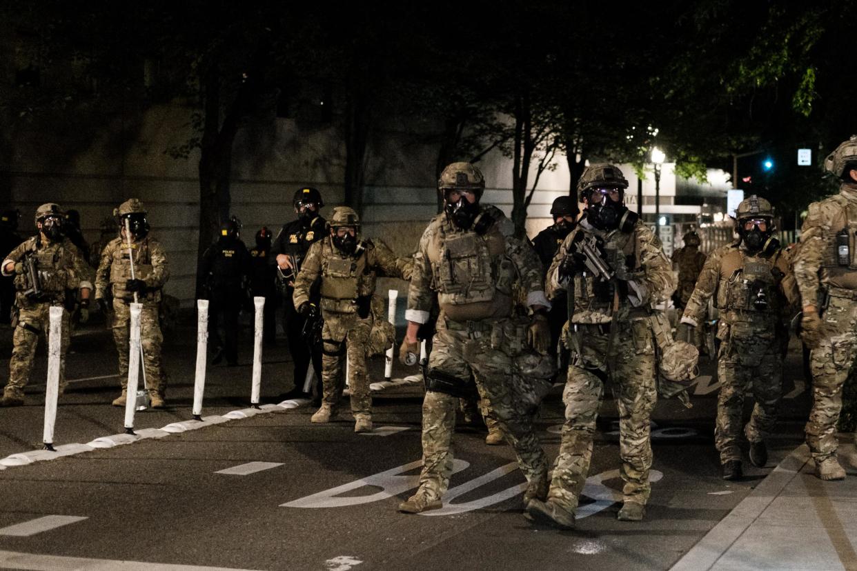 Federal officers prepare to disperse the crowd of protestors outside the Multnomah County Justice Center on July 17, 2020 in Portland, Oregon. Federal law enforcement agencies attempt to intervene as protests continue in Portland: Mason Trinca / Getty Images