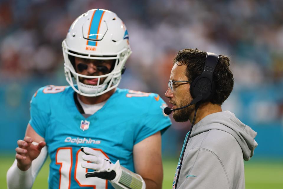 Aug 17, 2024; Miami Gardens, Florida, USA; Miami Dolphins head coach Mike McDaniel talks to quarterback Skylar Thompson (19) on the sideline against the Washington Commanders during the second quarter at Hard Rock Stadium. Mandatory Credit: Sam Navarro-USA TODAY Sports