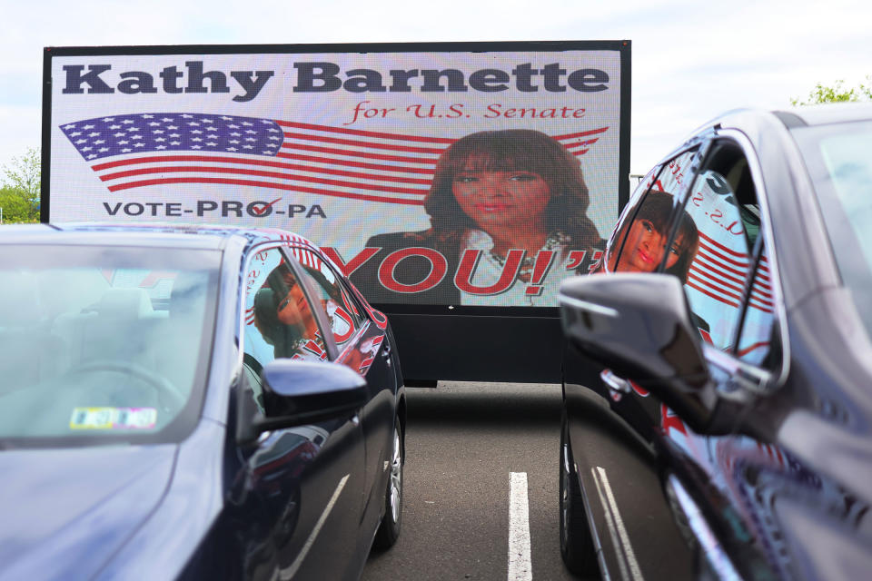 A van is festooned with campaign billboard for Pennsylvania Senate candidate Kathy Barnette ahead of a Republican leadership forum at Newtown Athletic Club in Newtown, Pa. on May 11, 2022.<span class="copyright">Michael M. Santiago—Getty Images</span>