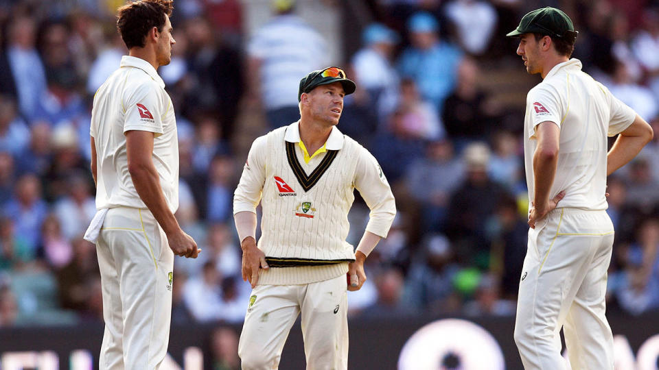 Mitchell Starc, David Warner and Pat Cummins. (Image: WILLIAM WEST/AFP/Getty Images)