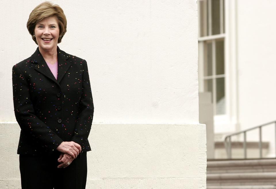 Laura Bush receives the White House Christmas Tree in 2005.