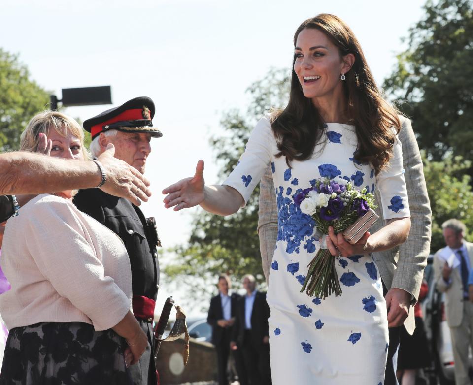 The Duchess of Cambridge greets well-wishers after her visit to Keech Hospice Care in Luton where she wore a dress by LK Bennett (Eddie Keogh/PA)