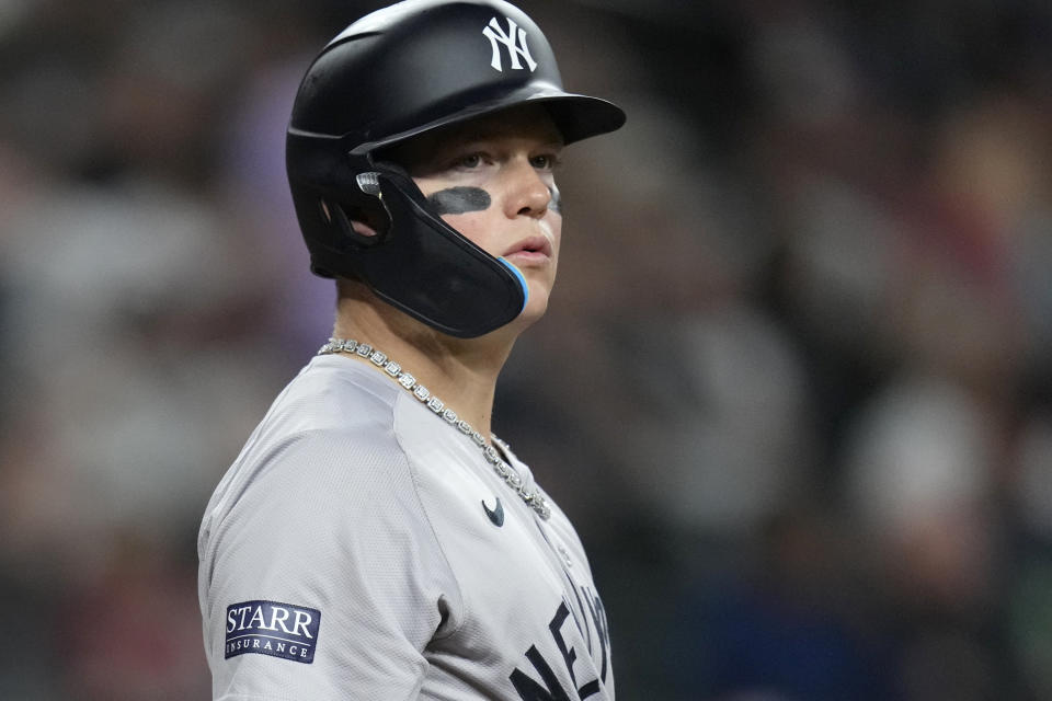 New York Yankees' Alex Verdugo pauses at home plate while batting during the seventh inning of a baseball game against the Arizona Diamondbacks Tuesday, April 2, 2024, in Phoenix. During his time with the Boston Red Sox, Alex Verdugo frequently played with several gaudy chains bouncing around his neck. He packs at least six for every road trip, and he's lost count of how many he owns. In his first season with the famously clean-cut New York Yankees, Verdugo has been given an order by manager Aaron Boone: only one chain per game. (AP Photo/Ross D. Franklin)