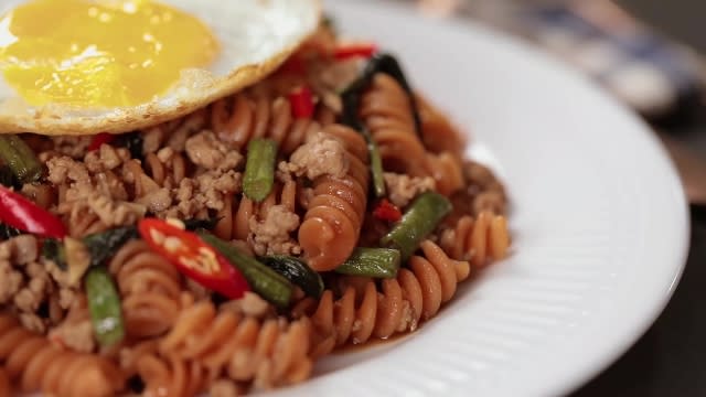 Thai Basil Pork with Red Lentil Fusilli and sunny side up