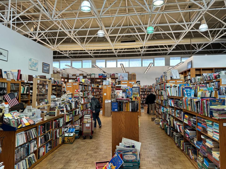 A larrge, densely packed bookstore is shown.