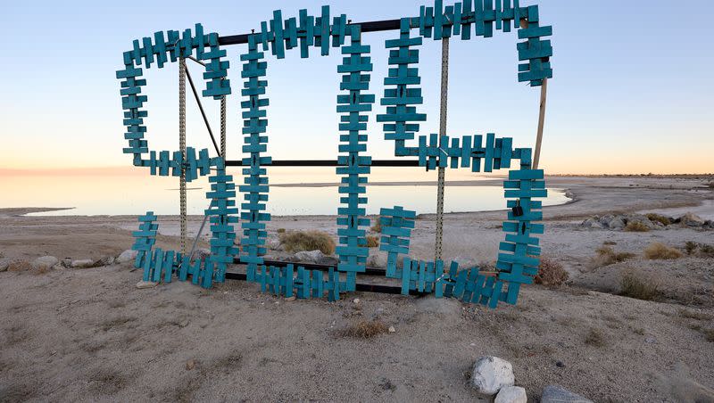 An SOS sign is pictured by the Salton Sea in Desert Shores, Calif., on Tuesday, Dec. 12, 2023.