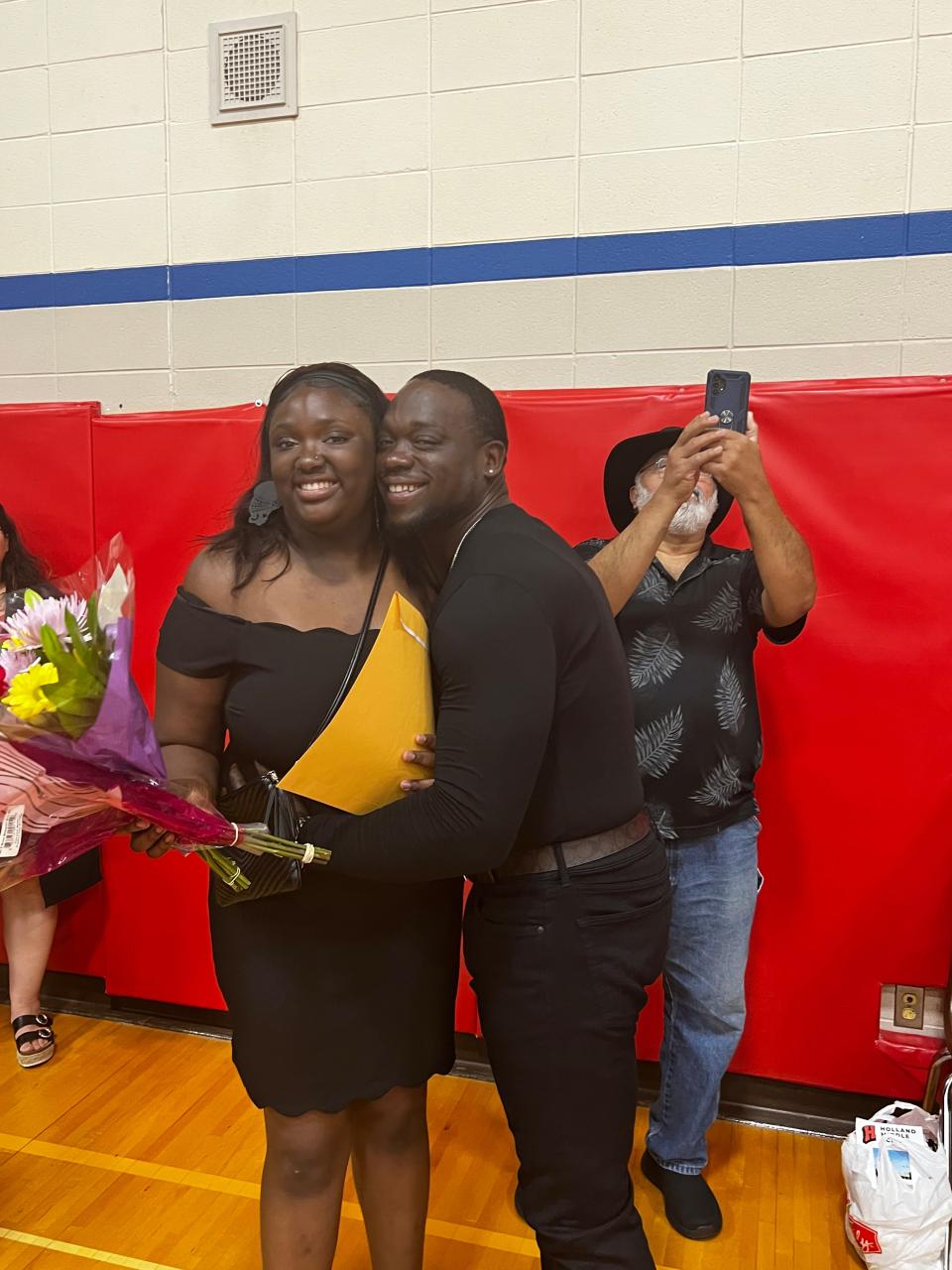 Joseph Roberts with his daughter at her eighth grade graduation earlier this year.