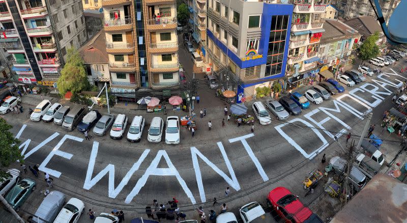 FILE PHOTO: A slogan is written on a street as a protest after the coup in Yangon