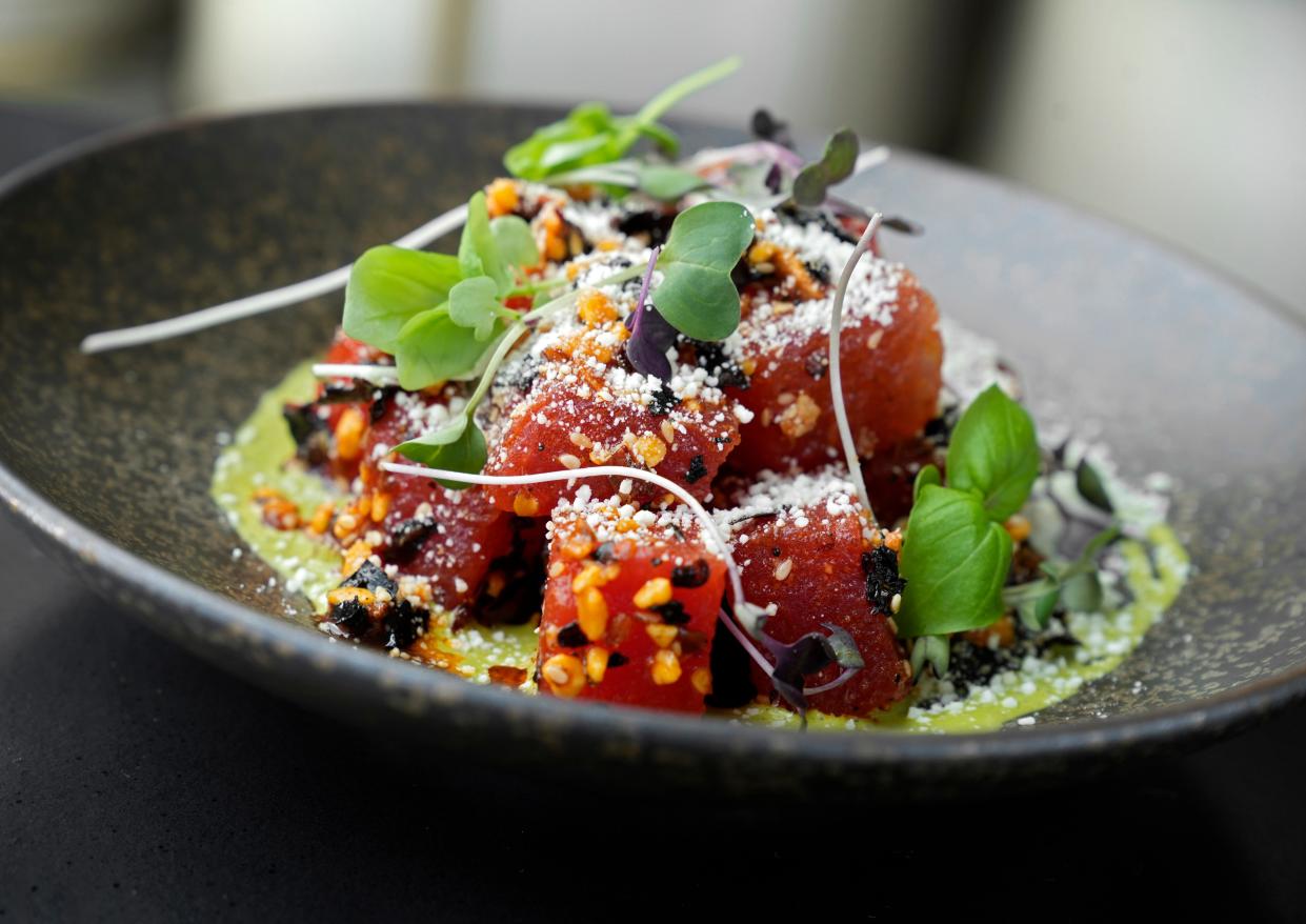 Watermelon appetizer with salsa macha, arugula salsa verde, cotija cheese and basil from the dinner menu at Goodale Station