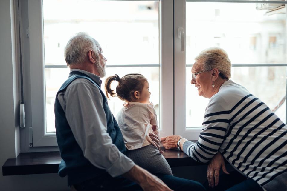 Stock image of grandparents with a child.