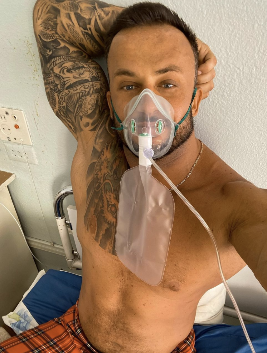 Dmitriy Stuzhuk is seen wearing an oxygen mask in hospital. 