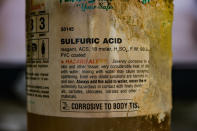 <p>The label on the bottle of acid looks like it’s been corroded by time. (Photo: Leland Kent/Caters News) </p>