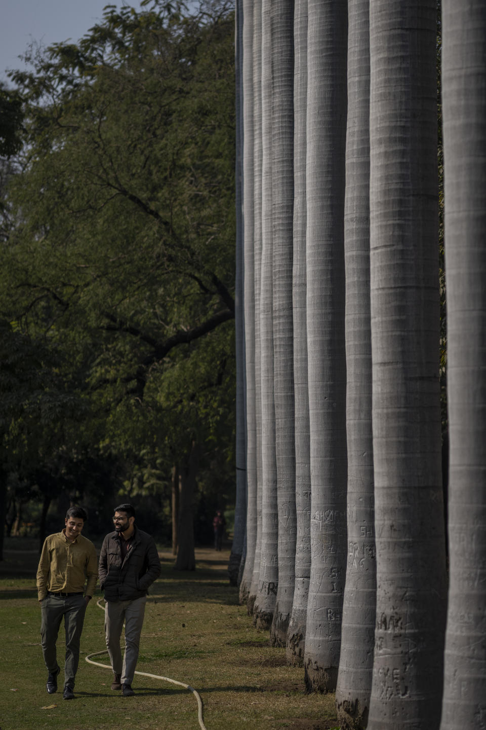 Indian gay couples Utkarsh Saxena, left, and Ananya Kotia, chat as they walk inside a public park in New Delhi, India, Jan. 18, 2023. The gay couples, now fifteen years into their relationship, have set out for a bigger challenge and filed a petition to India’s Supreme Court that seeks the legalization of same-sex marriage. (AP Photo/Altaf Qadri)