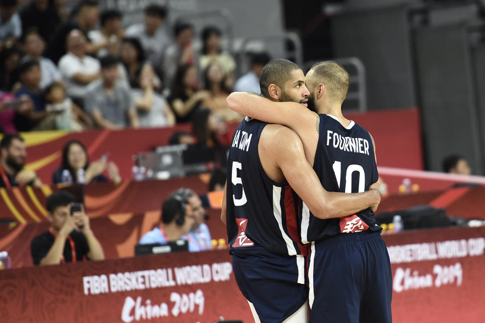 Evan Fournier et Nicolas Batum. (Photo by Ye Aung Thu / AFP)