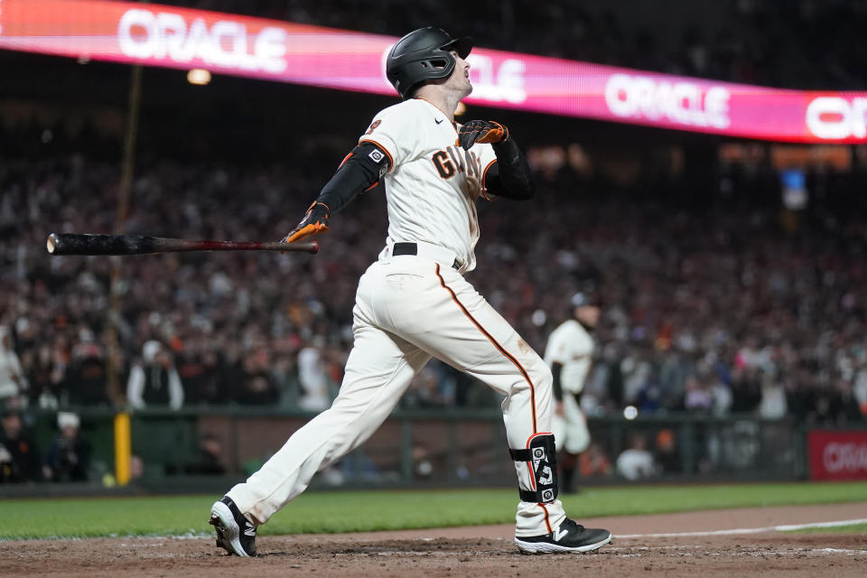 San Francisco Giants' Mike Yastrzemski watches his three-run home run during the 10th inning of a baseball game against the San Diego Padres in San Francisco, Monday, June 19, 2023. The Giants defeated the Padres 7-4 in 10 innings. (AP Photo/Jeff Chiu)