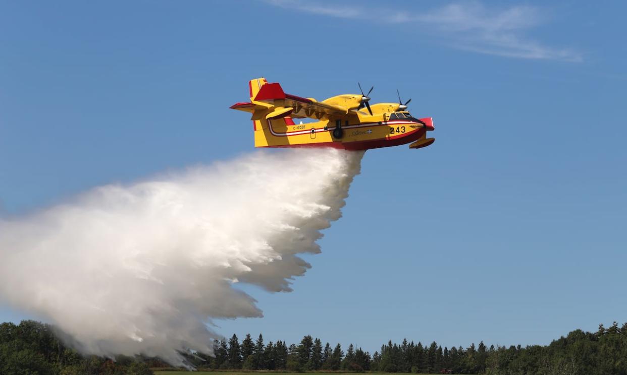 A 2023 file photo shows an air bomber. The province of Manitoba says air tankers from Saskatchewan are helping with suppression efforts as a fire burns out of control north of Flin Flon. (Patrick Doyle/The Canadian Press - image credit)