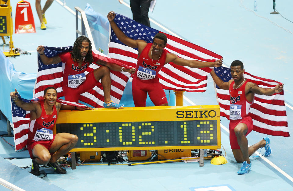 United States relay team with Kind Butler, David Verburg, Calvin Smith and Kyle Clemons, from left, celebrate after winning the 4x400m relay with a new world record during the Athletics World Indoor Championships in Sopot, Poland, Sunday, March 9, 2014. (AP Photo/Petr David Josek)