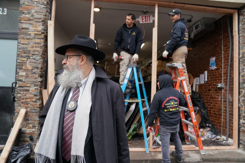 Demolition and recovery crews work at the scene of the December 10, 2019 shooting at a Jewish Deli, on December 11, 2019 in Jersey City, New Jersey. The shooters who unleashed a deadly firefight in Jersey City deliberately targeted a kosher grocery, the city's mayor said December 11, 2019, suggesting that it was an anti-Semitic attack.(Photo: Bryan R. Smith / AFP via Getty Images)