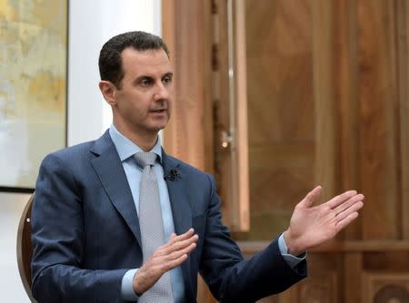 Syria's President Bashar al-Assad speaks during an interview with Yahoo News in this handout picture provided by SANA on February 10, 2017, Syria. SANA/Handout via REUTERS
