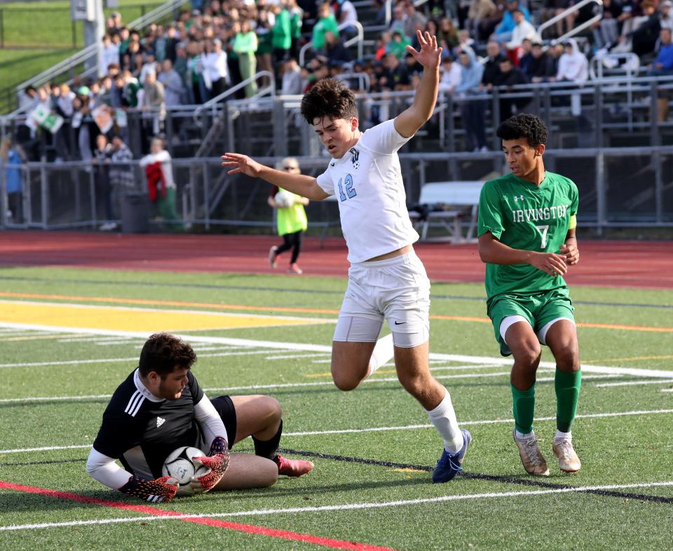 Westlake goalie Francesco Michilli, shown here during the Section 1 final, turned away the final Babylon penalty kick try, got up and netted his own penalty kick to send the Wildcats to the NYSPHSAA Class B final four next weekend.