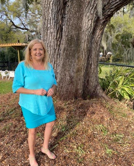 Pam Favre's massive tree extends over property line to former Silver Lake Country Club site.