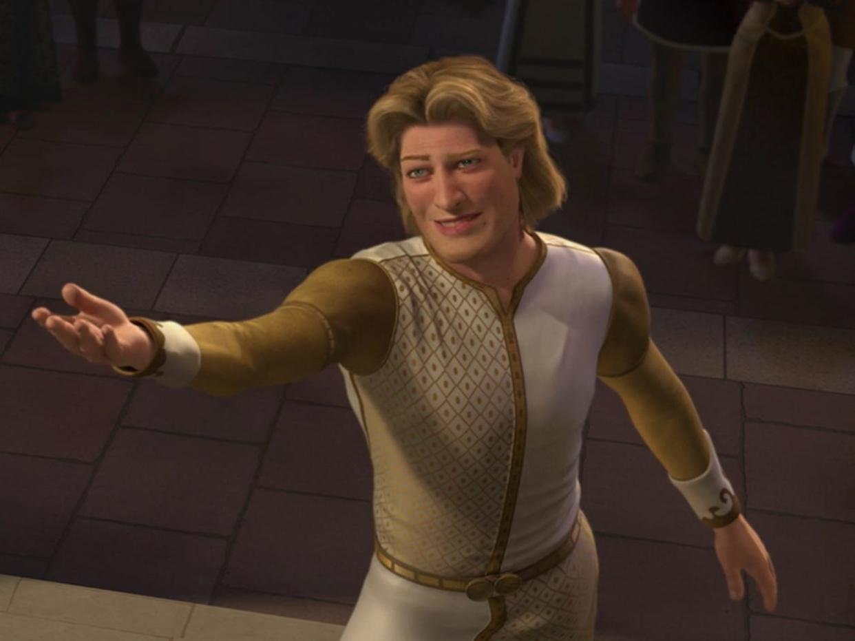 prince charming in "shrek 2" wearing a gold and white tunic, standing at the bottom of the stairs and reaching out his arm to a barely visible in frame princess fiona