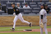 Pittsburgh Pirates' Josh VanMeter, left, watches his three-run home run off Colorado Rockies relief pitcher Justin Lawrence (61) during the seventh inning of a baseball game in Pittsburgh, Wednesday, May 25, 2022. The Pirates won 10-5. (AP Photo/Gene J. Puskar)