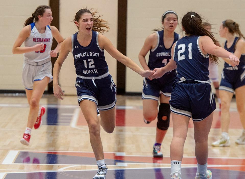 Council Rock North's Lizzie Lustig congratulates teammate Delaney McCaffrey during second-quarter action against Neshaminy High School, in Langhorne on Wednesday, Dec. 22, 2021.