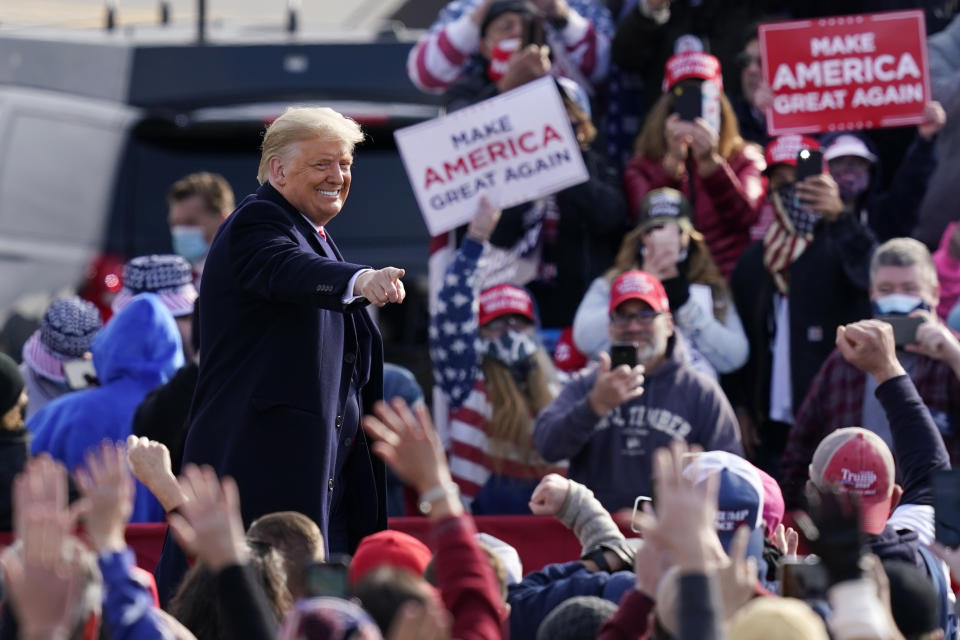 President Donald Trump points to supporters as he leaves a campaign rally at Manchester-Boston Regional Airport, Sunday, Oct. 25, 2020, in Londonderry, N.H. (AP Photo/Elise Amendola)