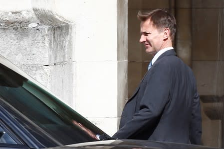 PM hopeful Jeremy Hunt walks near the Parliament grounds in London