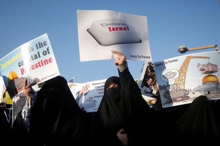 Veiled Muslim women hold placards during a protest, organised by various religious organisations, against the U.S. decision to recognise Jerusalem as the capital of Israel, in New Delhi, India, December 17, 2017. REUTERS/Adnan Abidi