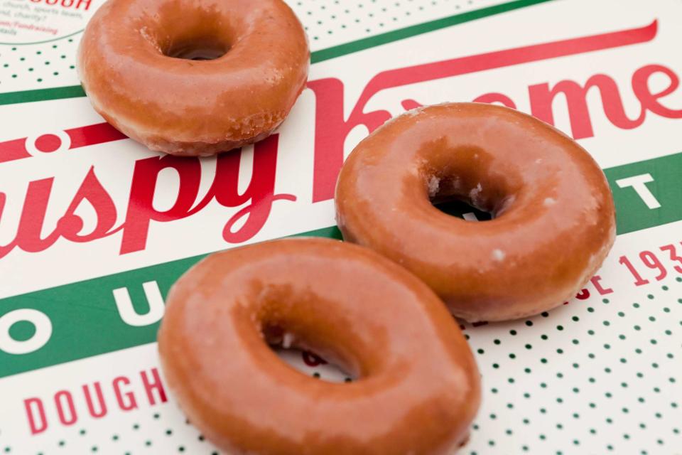 <p>Alamy</p> Clopse up of glazed Krispy Kreme donuts