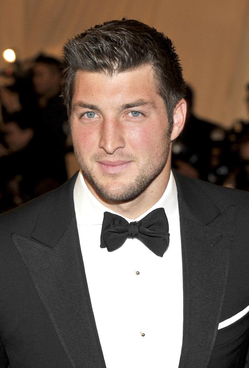 Tim Tebow arrives at the Metropolitan Museum of Art Costume Institute gala benefit, celebrating Elsa Schiaparelli and Miuccia Prada, Monday, May 7, 2012 in New York. (AP Photo/Charles Sykes)