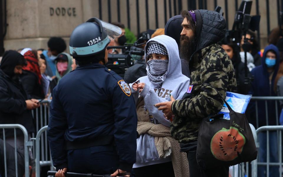 Police take security measures as demonstrators gather outside Columbia University