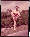 <p>Model Joyce Chrest poses with some carefully placed Hibiscus blooms. </p>