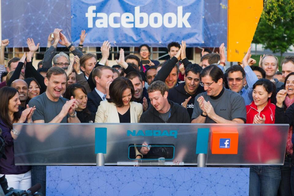 In this image provided by Facebook, Facebook founder, Chairman and CEO Mark Zuckerberg, center, rings the opening bell of the Nasdaq stock market, Friday, May 18, 2012, from Facebook headquarters in Menlo Park, Calif. The social media company priced its IPO on Thursday at $38 per share, and beginning Friday regular investors will have a chance to buy shares. (AP Photo/Nasdaq via Facebook, Zef Nikolla)