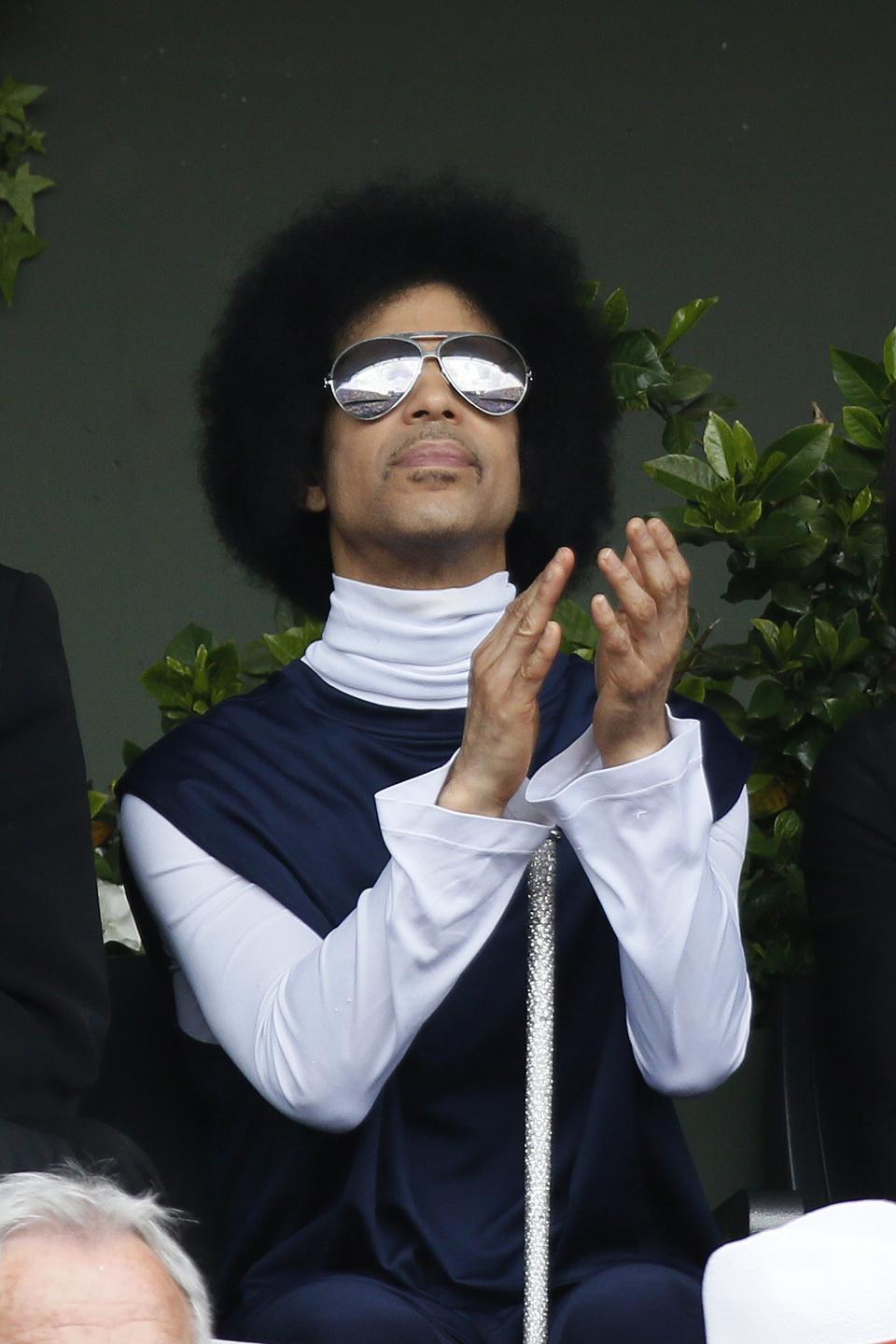 US singer Prince attends the French tennis Open round of sixteen match between Spain's Rafael Nadal and Serbia's Dusan Lajovic at the Roland Garros stadium in Paris on June 2, 2014.  AFP PHOTO / PATRICK KOVARIK        (Photo credit should read PATRICK KOVARIK/AFP/Getty Images)