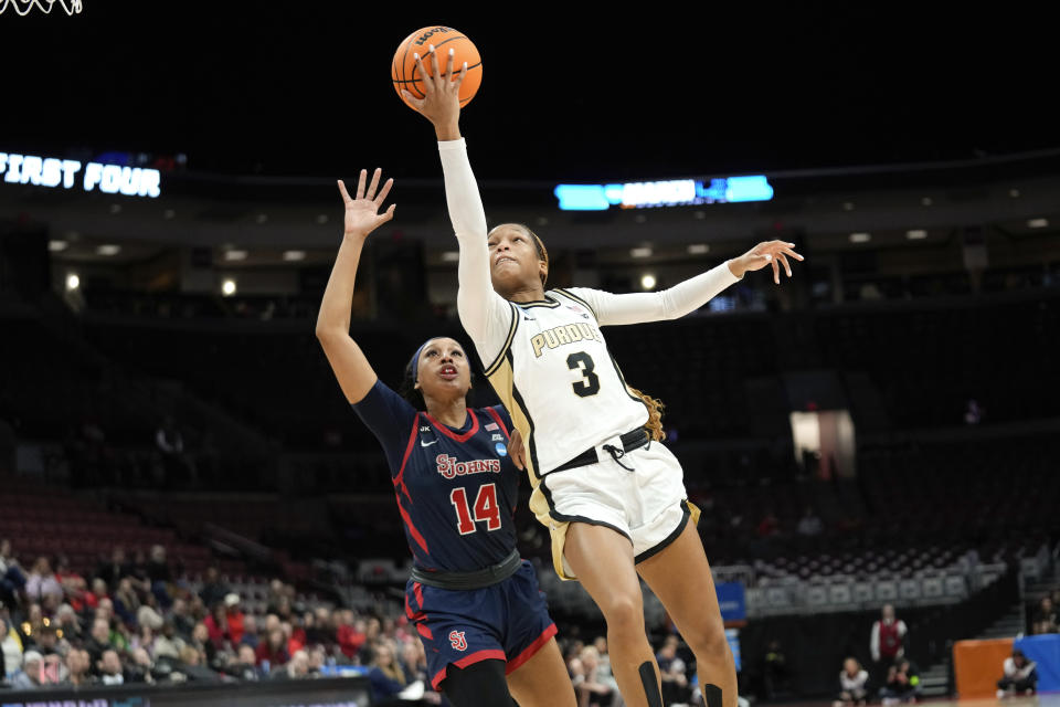 Purdue guard Jayla Smith (3) drives on St. John's forward Jillian Archer (14) in the second half of a First Four women's college basketball game in the NCAA Tournament Thursday, March 16, 2023, in Columbus, Ohio. (AP Photo/Paul Sancya)
