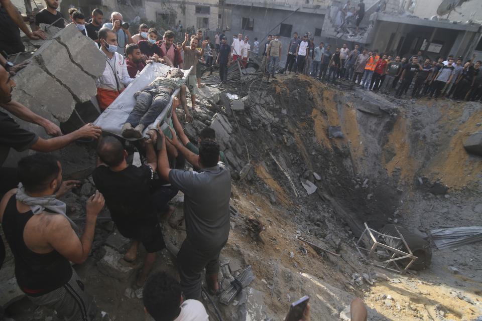 FILE - Palestinians pull a boy from the rubble after an Israeli strike on the Zaroub family house in Rafah, Gaza Strip, Tuesday, Oct. 24, 2023. The war between Israel and Hamas has brought carefully calibrated condemnations and warnings to both sides by Russia. (AP Photo/Hatem Ali, File)