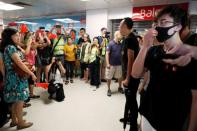 Pro-China demonstrators and anti-government protesters argue at Amoy Plaza shopping mall in Kowloon Bay, Hong Kong