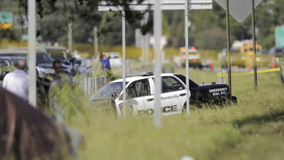 Two Mandeville police officers were shot after a vehicle chase, one fatally, near the U.S. 190 and Louisiana Highway 22 exit in Mandeville, La., Friday, Sept. 20, 2019. (David Grunfeld/The Advocate via AP)