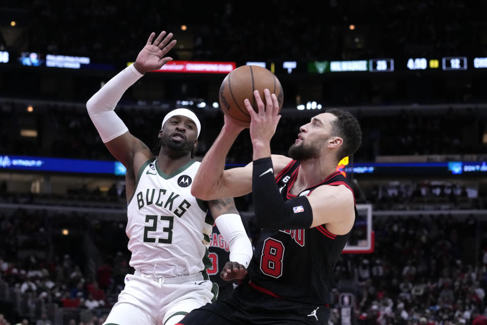 Chicago Bulls' Zach LaVine (8) looks to shoot as Milwaukee Bucks' Wesley Matthews defends during the first half of an NBA basketball game Thursday, Feb. 16, 2023, in Chicago. (AP Photo/Charles Rex Arbogast)