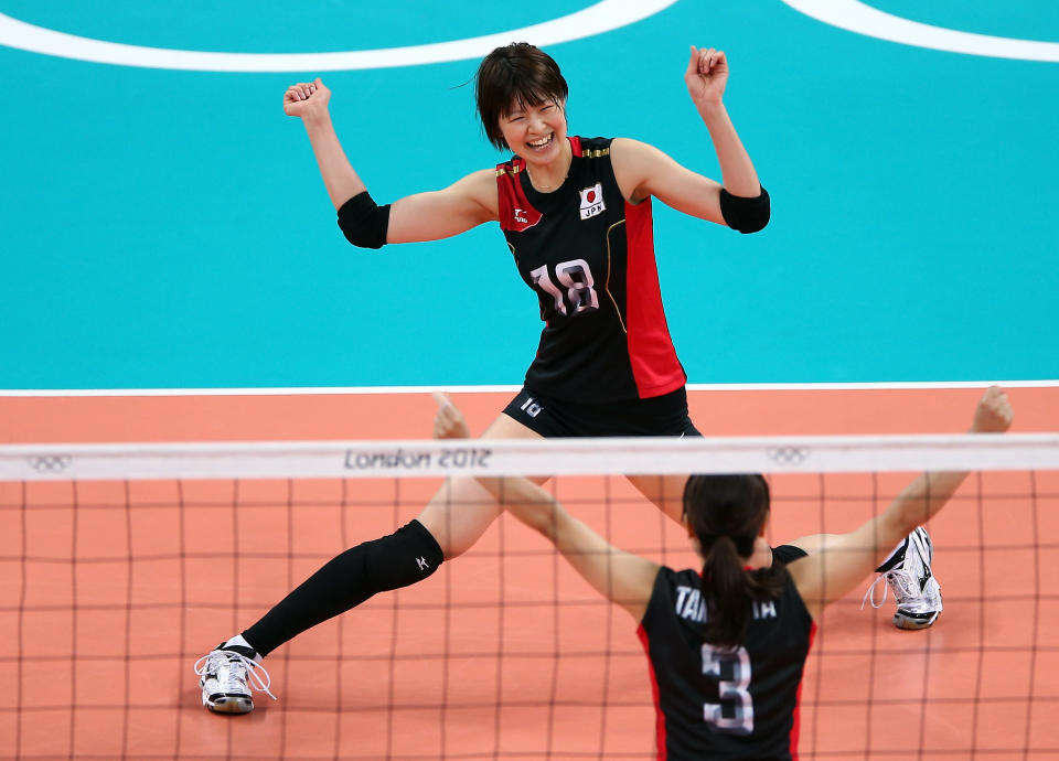 LONDON, ENGLAND - AUGUST 01: Saori Kimura #18 and Yoshie Takeshita #3 of Japan celebrate a point in the second set against Dominican Republic during Women's Volleyball on Day 5 of the London 2012 Olympic Games at Earls Court on August 1, 2012 in London, England. (Photo by Elsa/Getty Images)