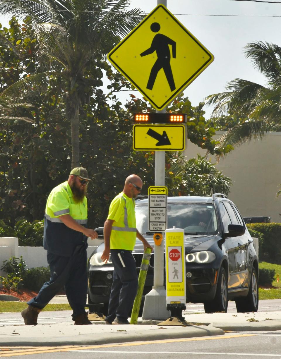 A flashing yellow light pedestrian crossover onHighway A1A in Indian Harbour Beach.