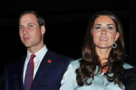 Prince William, Duke of Cambridge and Catherine, Duchess of Cambridge look on ahead of the Olympic Games 2012 Opening Ceremony on July 27, 2012 in London, England. Athletes, heads of state and dignitaries from around the world have gathered in the Olympic Stadium for the opening ceremony of the 30th Olympiad. London plays host to the 2012 Olympic Games which will see 26 sports contested by 10,500 athletes over 17 days of competition. (Photo by John Stillwell - WPA Pool/Getty Images)