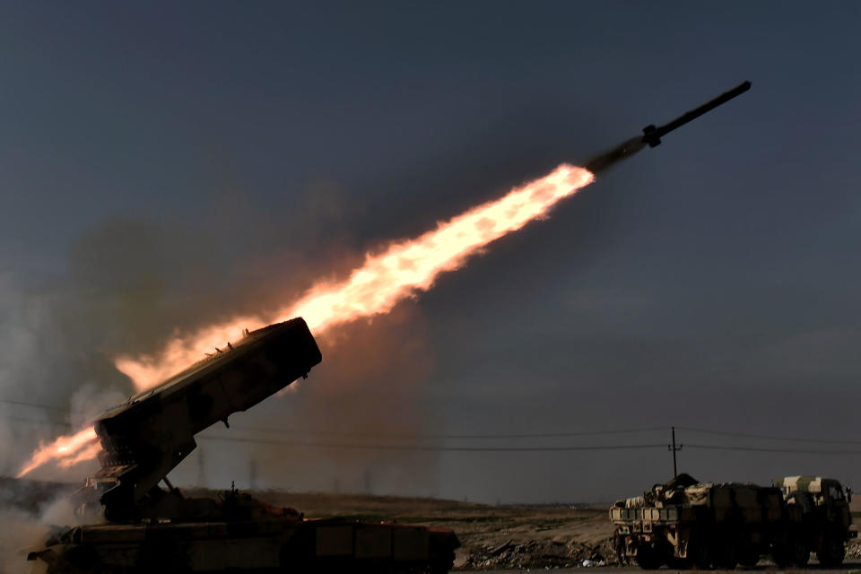 <p>Iraqi troops fire a missile toward Islamic State (ISIS) group fighters from the outskirts of Mosul as Iraqi forces battle the group to recapture the west of the city on Feb. 28, 2017.<br> Hundreds of civilians fled through the desert to escape fighting and privation in Mosul, joining thousands of others who left their homes as conditions worsen in the city’s west. (Aris Messinis/AFP/Getty Images) </p>