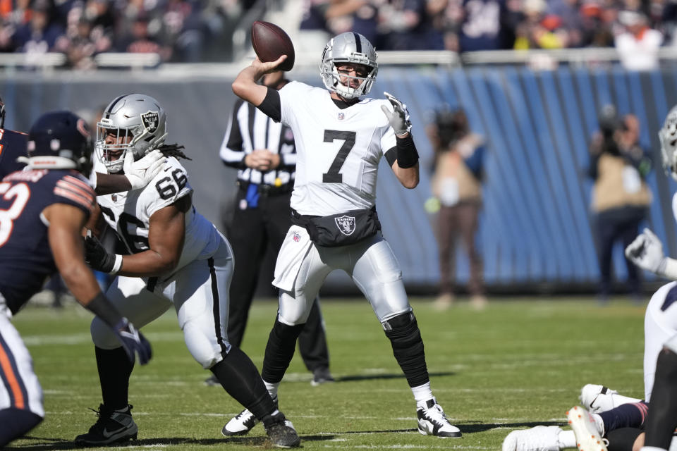 Las Vegas Raiders quarterback Brian Hoyer (7) passes against the Chicago Bears in the first half of an NFL football game, Sunday, Oct. 22, 2023, in Chicago. (AP Photo/Charles Rex Arbogast)