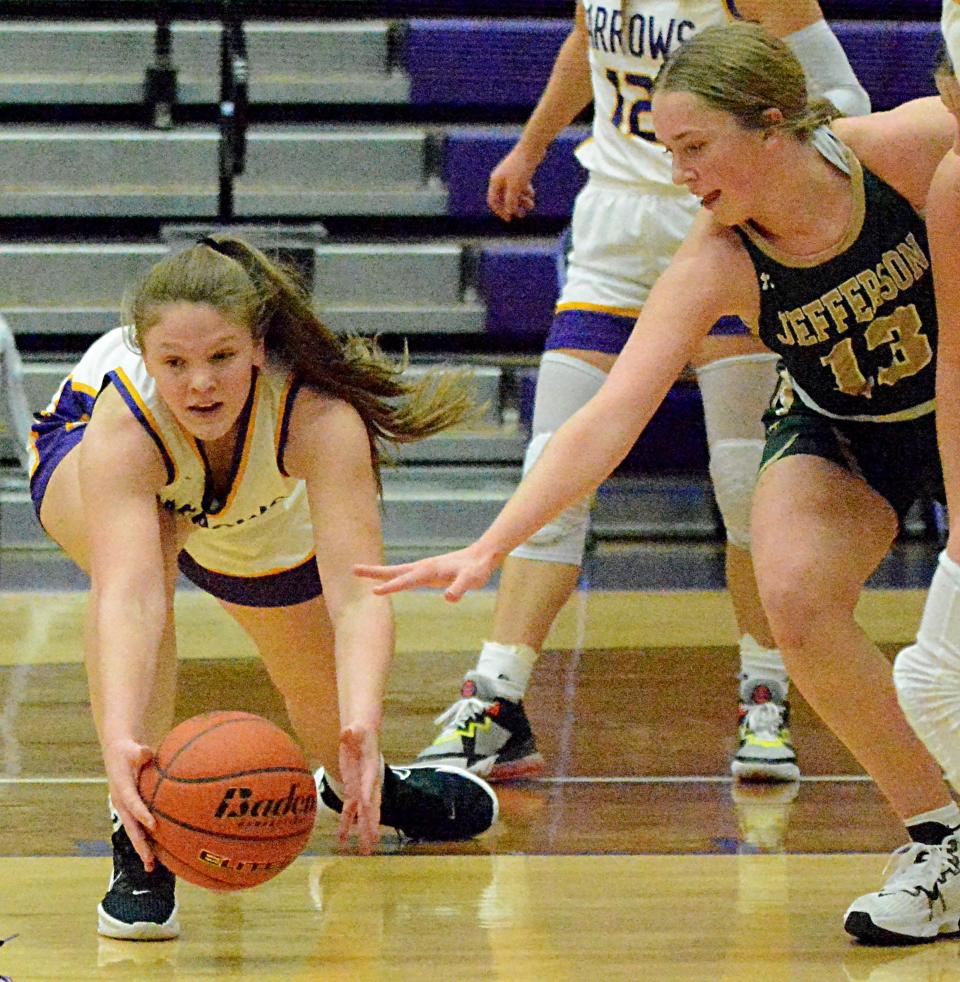 Watertown's Grace Corey pulls in a loose ball against Sioux Falls Jefferson's Abby Horner during their high school girls basketball game on Tuesday, Feb. 7, 2023 in the Watertown Civic Arena. No. 1 Jefferson won 49-40 in overtime.