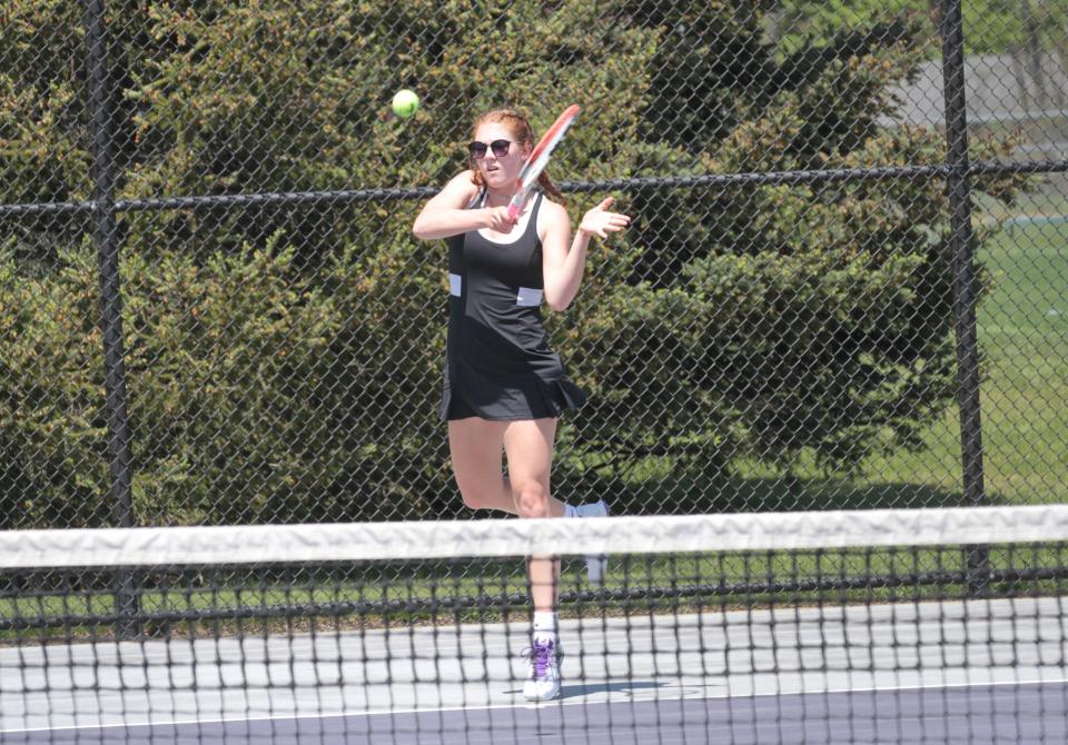 Tess Scheske hits a return shot in her match against Arabella Mangold at third singles on Tuesday.